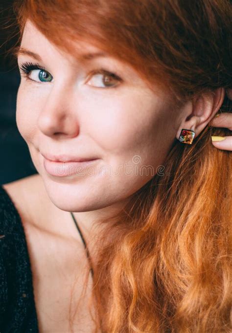 Vertical Portrait Of A Beautiful Red Haired Curly Girl With Make Up And