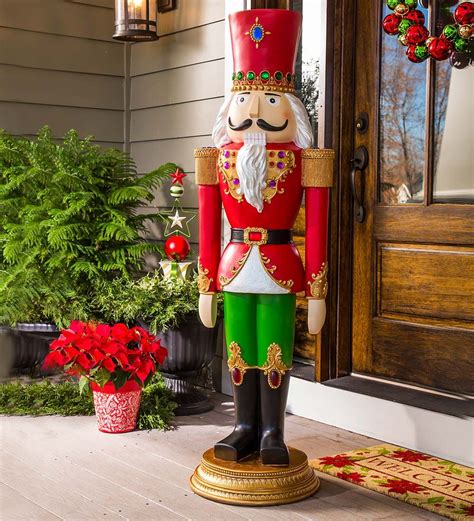 Giant Sized Nutcracker Statue In Outdoor Holiday Decorations