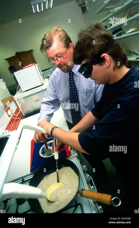 Tutor Assisting Visually Impaired Person With Cooking Skills Guide