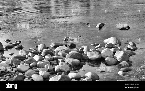 View Of Pebbles On Riverbank Stock Photo Alamy