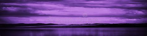 Purple Sunset Sky With Clouds Over The Sea Dramatic Mountains On The