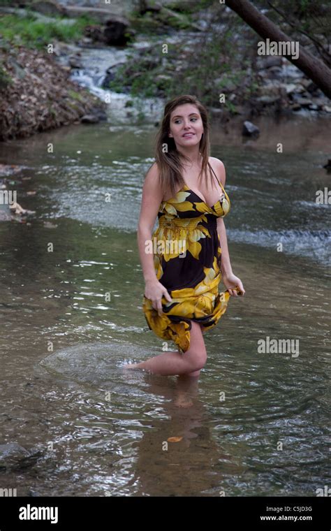 Woman Wading In Water In A Dress Hi Res Stock Photography And Images