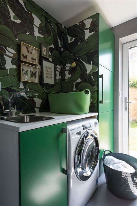 Green Tropical Laundry Room With Vibrant Wallpaper And Coloured