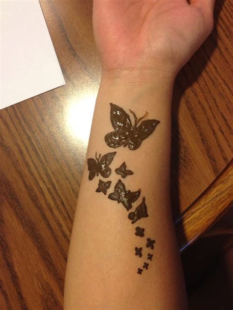 A Womans Arm With Butterflies On It