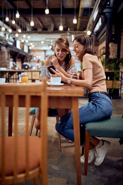 Young Happy Girlfriends Enjoying Coffee Time Together Modern