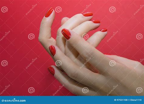 Beautiful Female Hands With Red Manicure And Nail Isolated Stock Photo