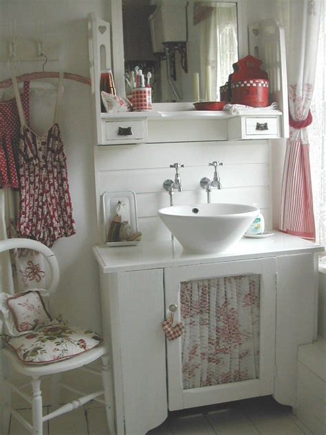 The following bathrooms feature flowers in pink used as patterns on. bathroom - cabinet made from old dressing table ... love ...