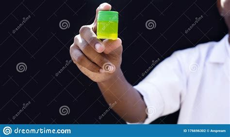 Nurse Or Young Doctor Holding Drug Bottle On Black Background Concept