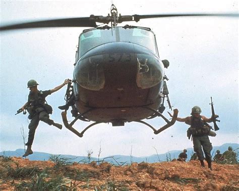 Soldiers From 1st Cavalry Division Jump From A Helicopter During