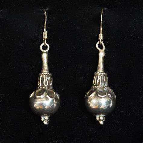 Sterling Silver Drop Earrings Featuring A Solid Decorated Bead Quiet West