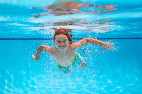 Child Underwater Funny Face Portrait Of Child Boy Swimming And Diving