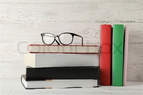 Books And Glasses Against Wooden Rustic Stock Image Colourbox