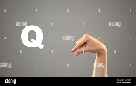 Letter Q In Sign Language Hand On Background Communication For Deaf