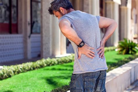Man With Back Pain At The Street People Health Care And Medicine