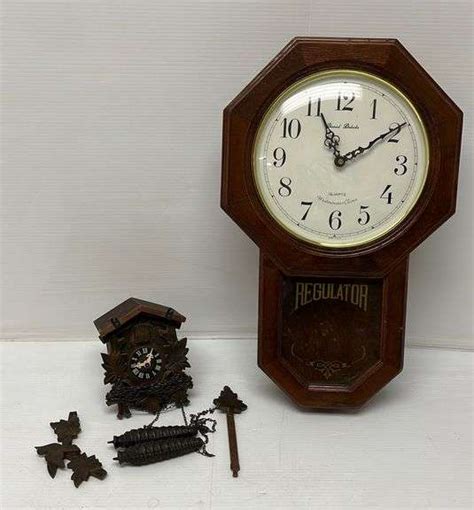2 Clocks Includes 1 Older Coo Coo Clock And 1 Regulator Wall