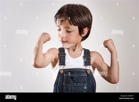 Boy Flexing Muscles Stock Photo Alamy
