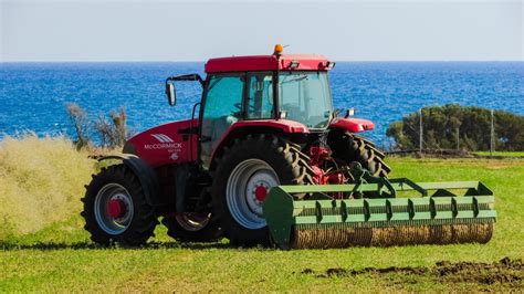 free images tractor field farm rural farming equipment agriculture grassland harvester