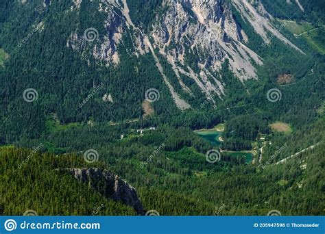 Beautiful Green Lake In A Forest Landscape In The Mountains Stock Photo