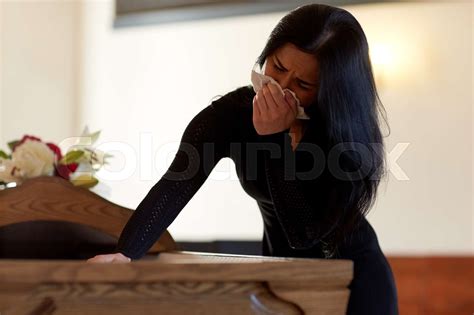 Woman With Coffin Crying At Funeral In Church Stock Image Colourbox