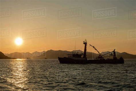 The Sun Rises Over Kulukak Bay And A Commercial Fishing Tender In The