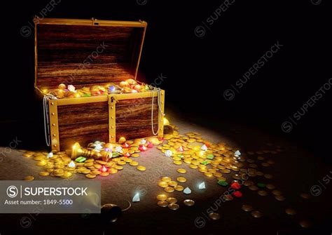 Gold Coins And Jewels Spilling From Treasure Chest Superstock