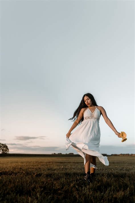 Woman In White Dress Walking On Field · Free Stock Photo