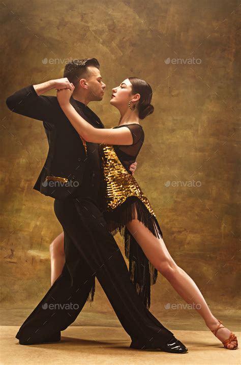 Dance Ballroom Couple In Gold Dress Dancing On Studio Background Stock