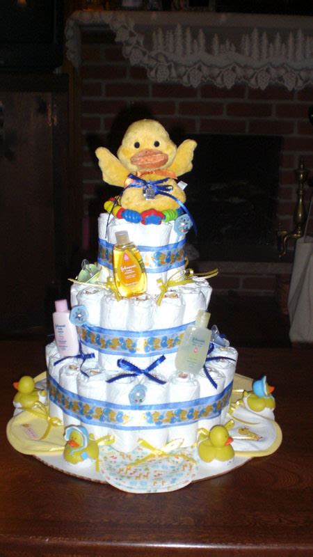 This baby rattle cake has a fun, modern design with several circles and rings covering its surface. Rubber Ducky Diaper Cake Pictures & Ideas