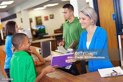 Checking Out Book Library Photos And Premium High Res Pictures Getty