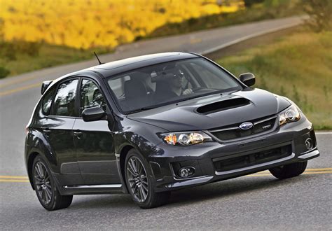 A hatchback is a car body configuration with a rear door that swings upward to provide access to a cargo area. 2013 Subaru WRX Hatchback