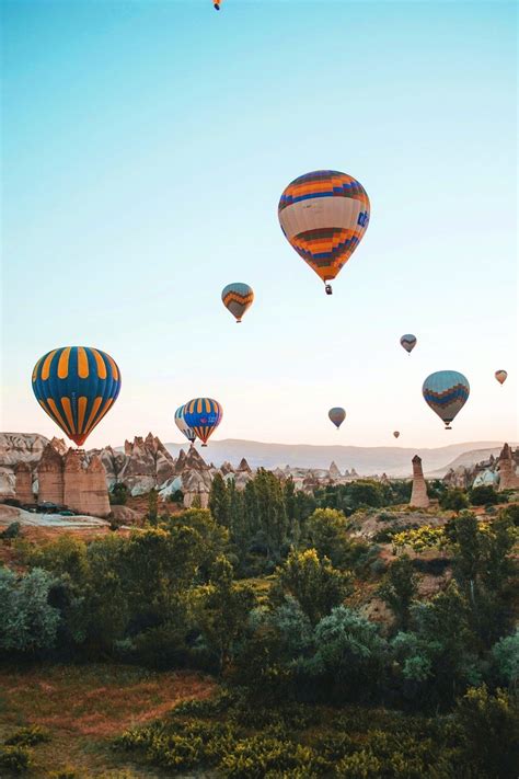 Hot Air Balloons Flying Over Cappadocia Turkey Photograph By Alex