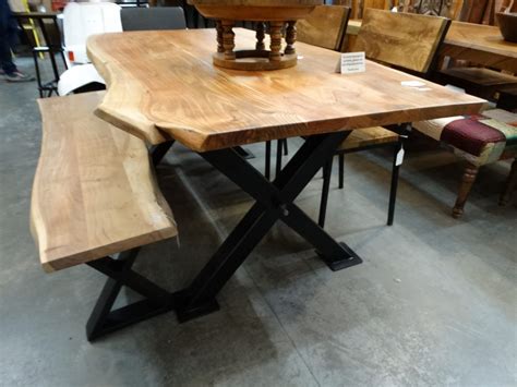 Dining table, it does not completely fill the entire table. Wooden Dining Table features a black metal X base.