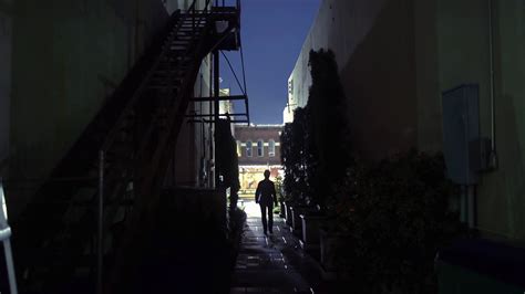 Woman Walks Toward Camera From Dark Alley 4k Stock Footage Sbv