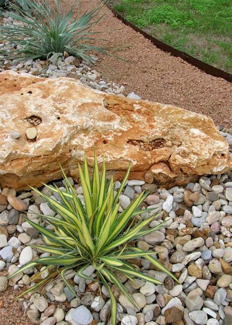 Front yard landscaping with rocks. Design My Yard: use of diff sized rocks plus grasses/flax ...