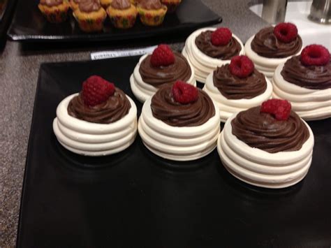 Pistachio meringues with lemon curd and berries. Chocolate mouse in meringue cups topped with raspberries ...