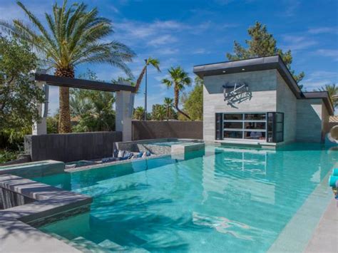 Another idea of backyard pool bar ideas that's more interesting is build the bar in the middle of the pool. Contemporary Pool With Swim-Up Bar | HGTV