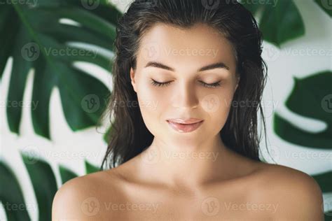Portrait Of Young And Beautiful Woman With Perfect Smooth Skin In Tropical Leaves 16200539 Stock
