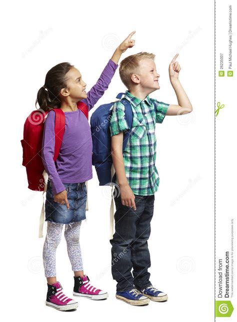 School Boy And Girl With Backpacks Pointing Stock Image