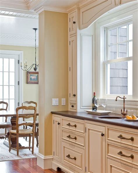 Does anyone know what that white would be equivalent to in the benjamin moore line? Antique White SW 6119. Antiqued cabinets. | Kitchen paint ...