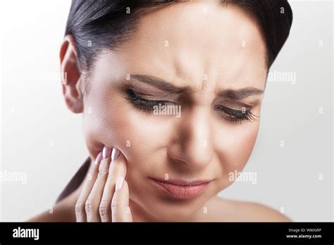 Pain Teeth Problem Woman Feeling Tooth Pain Closeup Of A Beautiful Sad Girl Suffering From