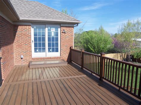 Decks can also wrap around garden features, like a feature tree, or curve through your garden. Trex Spiced rum decking | Red brick house, House deck ...