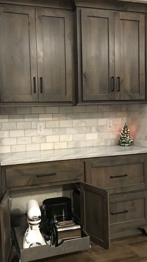 You can spice up the brown kitchen colors by using different accessories that have different colors. Grey Stained Knotty Alder Cabinets | www.stkittsvilla.com