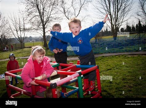 Children Playing Outside School In Playground Stock Photo Alamy