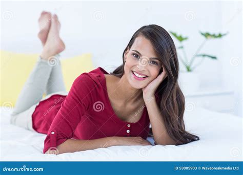 Beautiful Brunette Lying On Bed Looking At Camera Stock Image Image