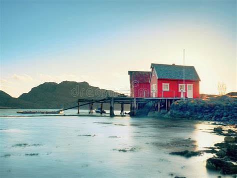 Norwegian Coast Landscape With A Typical Red House Wooden Red House On
