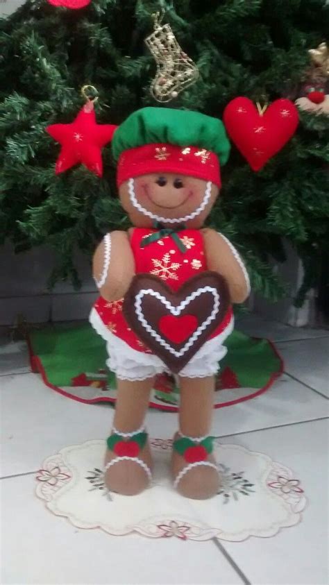 A Christmas Ornament With A Heart In The Shape Of A Gingerbread Man