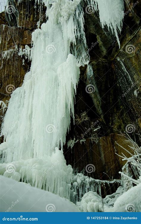 Frozen Waterfall Among The Rocks The Waterfall Is Freezing Huge