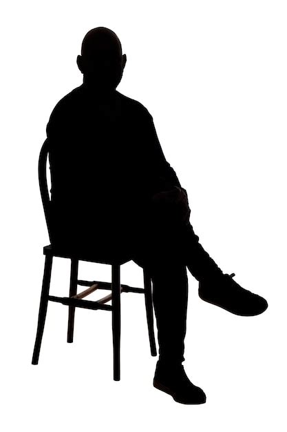 Premium Photo Front View Of The Silhouette Of A Man Sitting On Chair