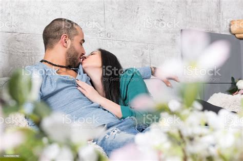 View From Flowers On Beautiful International Couple Of Man With Beard