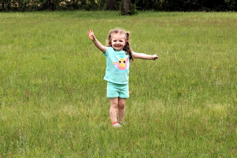 Happy Little Girl In Grass Free Stock Photo Public Domain Pictures